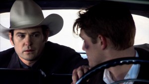 HANK (Henry Thomas) and SILAS (Jesse James) in conversation following a rowdy night. From THE LAST RIDE [Harry Thomason, Director / James Roberson, Cinematographer]